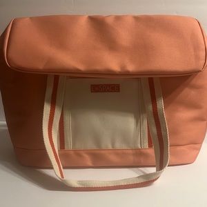 L* Space  coastal thermal cooler bag. Coral colored. Ext front pocket